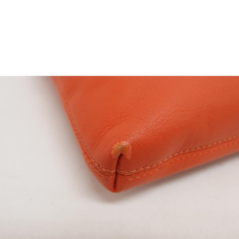 COACH オレンジ クラッチバッグレザーバッグ